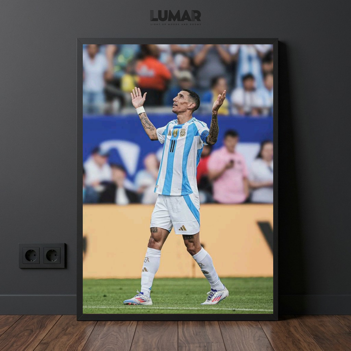 Framed poster of Ángel Di María celebrating in an Argentina national team kit on the pitch.