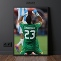 Framed poster of Emiliano Martínez celebrating on his knees in a green goalkeeper kit with number 23.