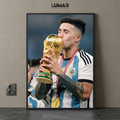 Framed poster of Enzo Fernández kissing the World Cup trophy while wearing his Argentina kit and medal.